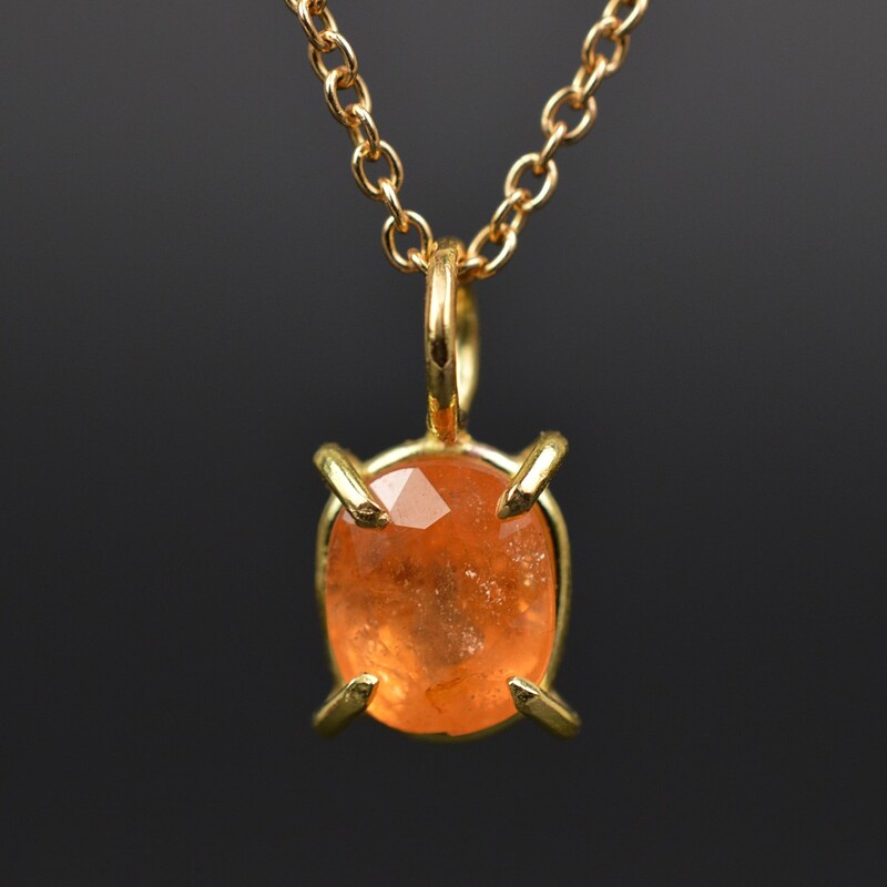 Close up phto of the Fanta Garnet necklace pendant