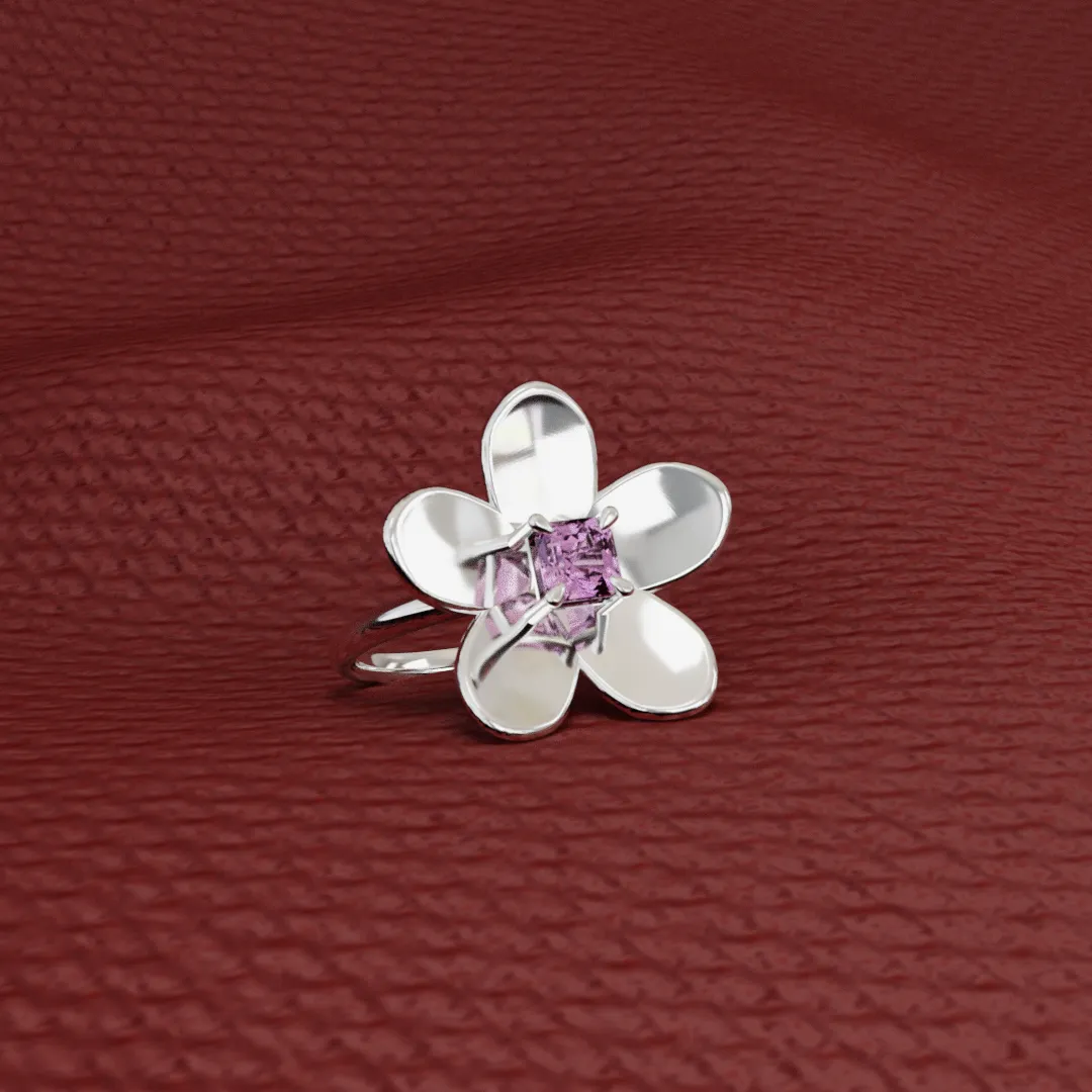 18k white gold petals surrounding a blush pink spinel. Part of the Garrett Ray Blossoms collection.