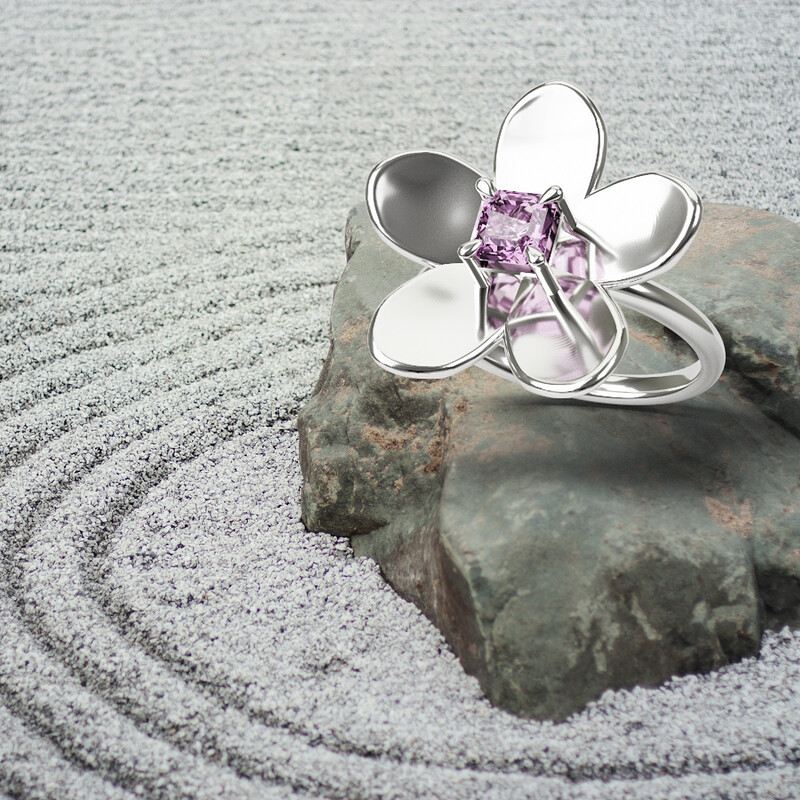 Photo of a Sakura Blossom White Gold Ring in a Japanese Zen garden.