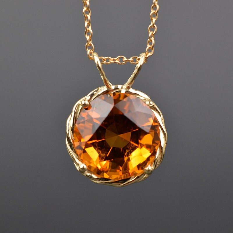 Close up photo of a finished Madeira Citrine gold pendant.